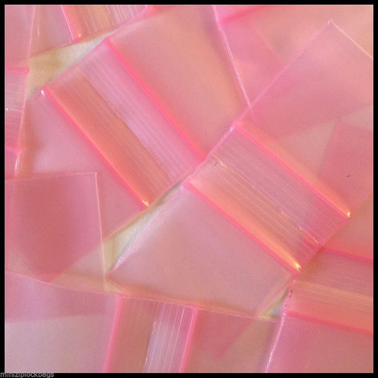 Pink resealable bags from Original Apple Bags, 1.25 x 1 inch, perfect for packaging small items or gifts.