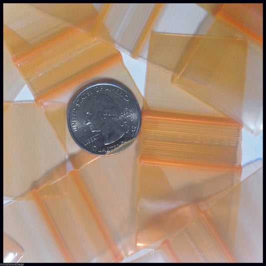 Orange resealable bags from Original Apple Bags, 1.25" x 1", ideal for packaging and storage.