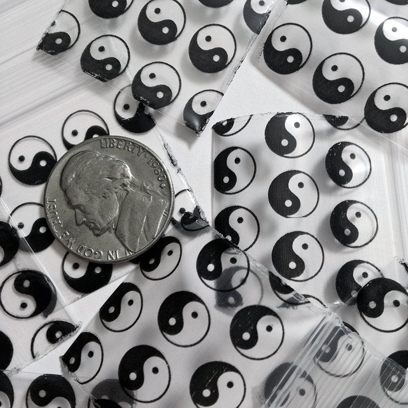 Original Apple Bags resealable bags featuring TaiJi/Yin Yang design, 1.25 x 1.25 inches, perfect for storage or packaging.