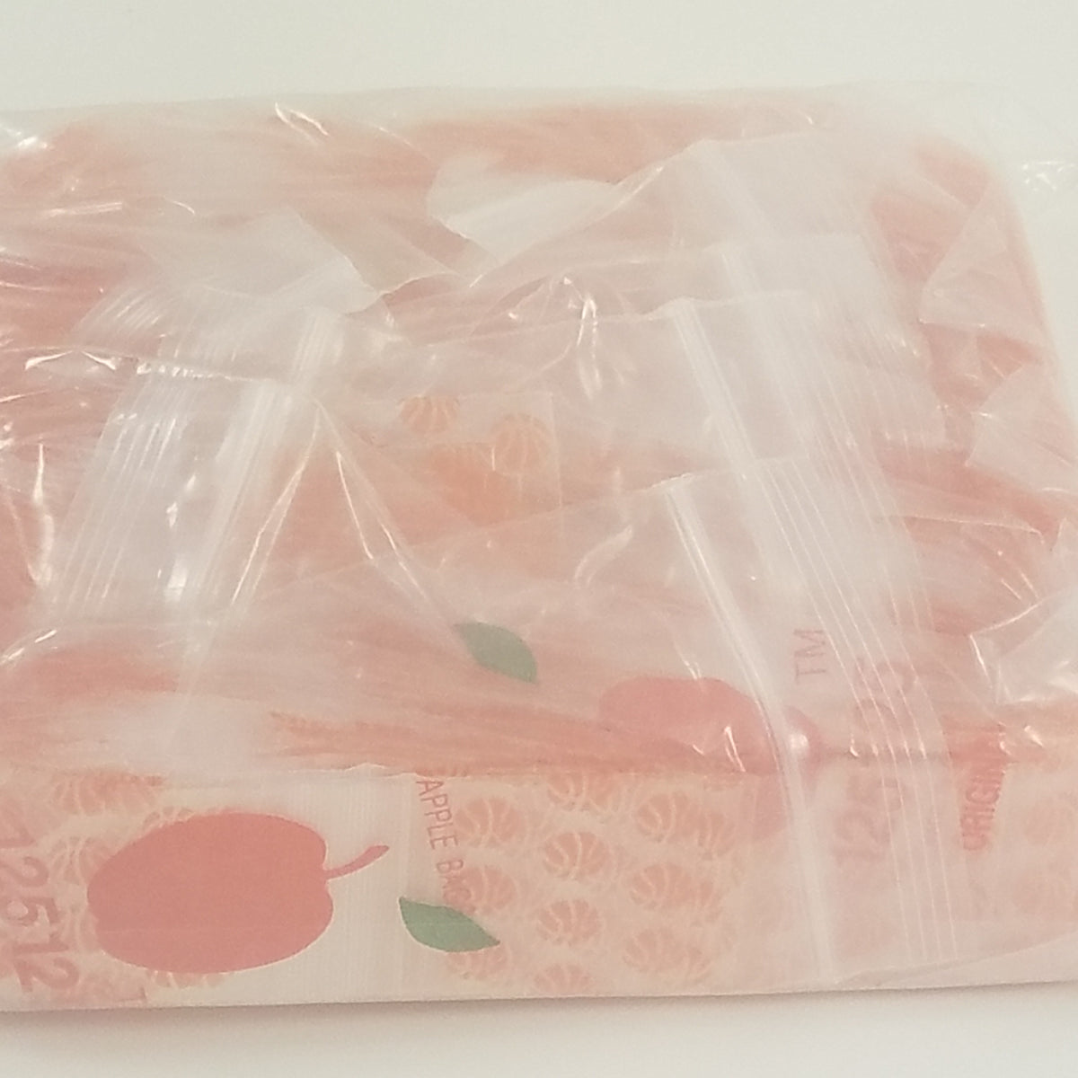 Resealable Original Apple Bags with basketball design, 1.25 x 1.25 inches, ideal for small items or snacks.