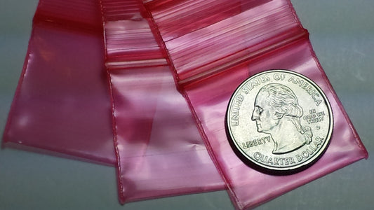 Red 1.25 x 1.25-inch resealable bags from Original Apple Bags, perfect for storage and organization.