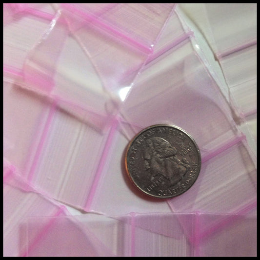 Pink 1.25"x1.25" resealable Apple Bags by Original Apple Bags, showing the pink, resealable plastic bags with a clear design.