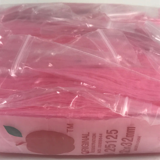 Pink resealable bags from Original Apple Bags, 1.25 x 1.25 inches, ideal for packaging small items or gifts.