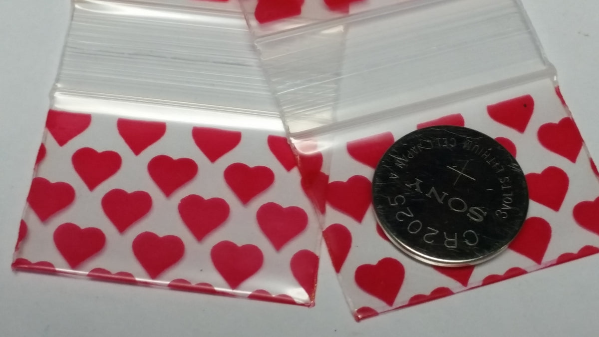 Original Apple Bags resealable bags with heart pattern, 1.5" x 1" size, ideal for packaging small items or gifts.