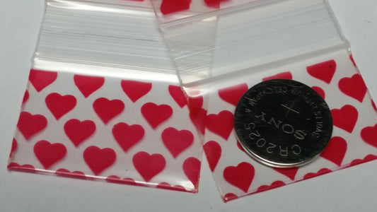 Original Apple Bags resealable bags with heart pattern, 1.5" x 1" size, ideal for packaging small items or gifts.