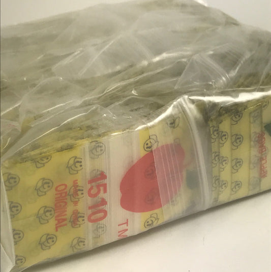 Original Apple Bags resealable bags with a happy face design, measuring 1.5" x 1" for small storage or packaging.