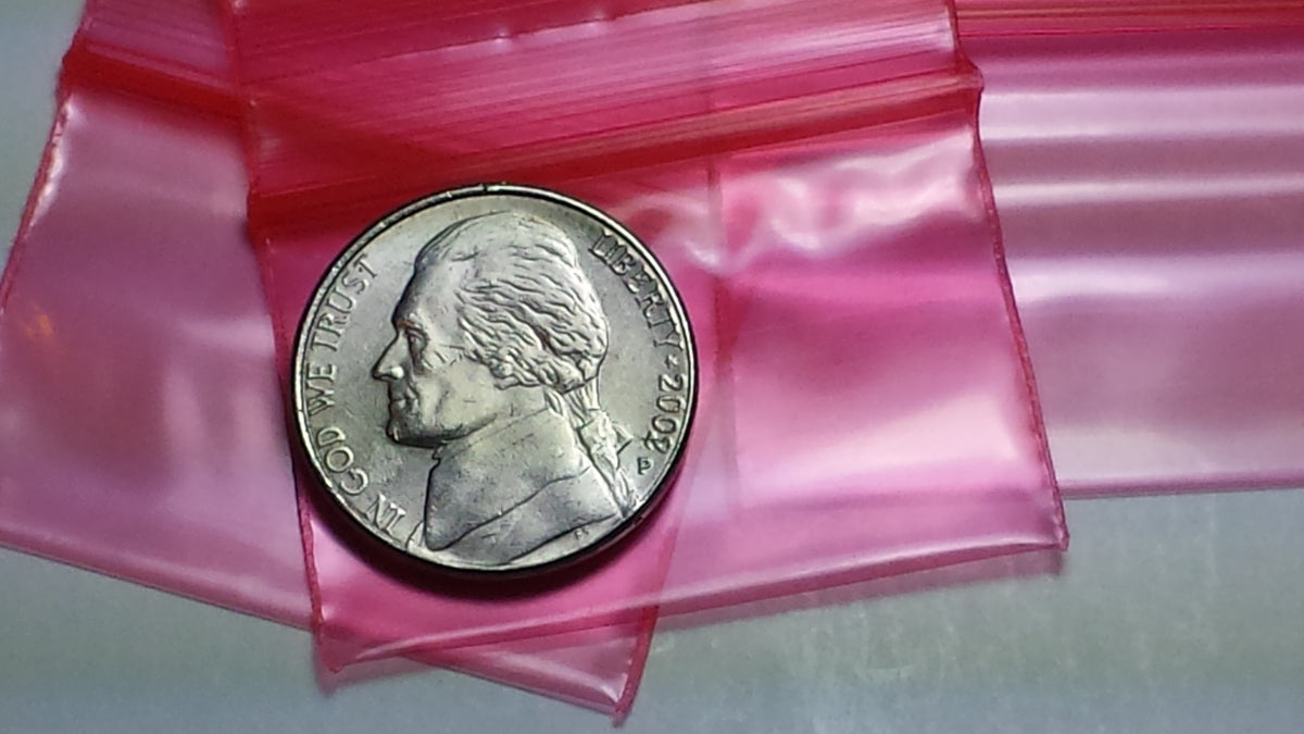 Red 1.5"x1" resealable Apple Bags by Original Apple Bags, perfect for storing small items securely.