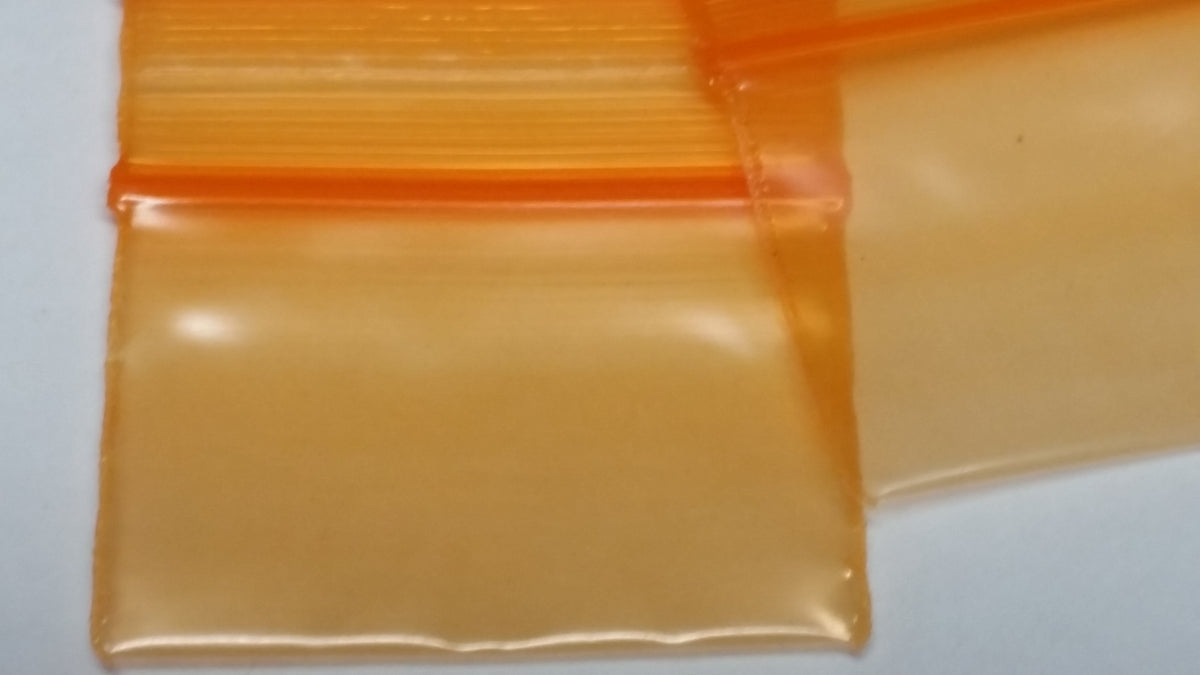 Orange 1.5" x 1" resealable Original Apple Bags for storing small items or snacks, featuring secure closure and durable material.