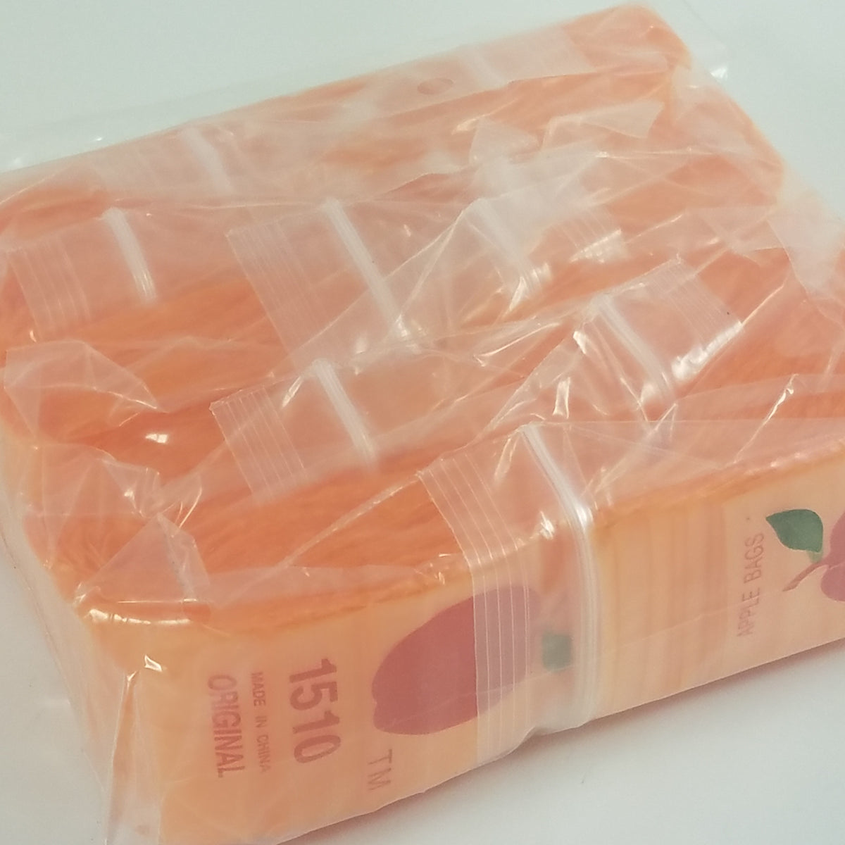 Orange 1.5x1-inch resealable Apple Bags by Original Apple Bags, durable plastic storage with secure closure.