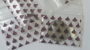 Resealable chocolate-colored apple bags from Original Apple Bags, 1.5 x 1.25 inches, ideal for packaging small items.