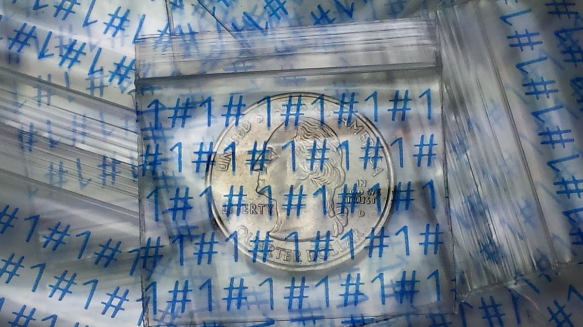 Original Apple Bags resealable bags, 1.5 x 1.25 inches, featuring the NUMBER ONE #1 design, perfect for small item storage.