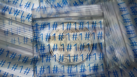 Original Apple Bags resealable bags, 1.5 x 1.25 inches, featuring the NUMBER ONE #1 design, perfect for small item storage.