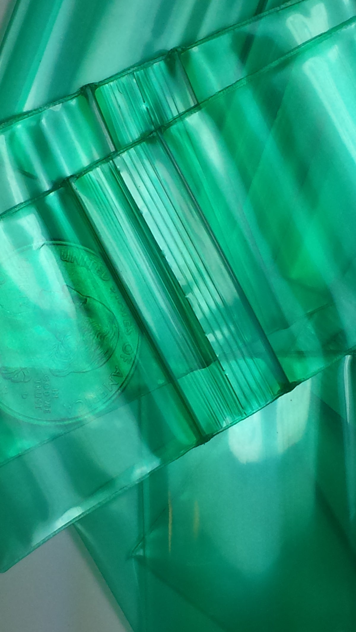 Green Original Apple Bags resealable bags, 1.5" x 1.25", featuring the product label and transparent material for storage.