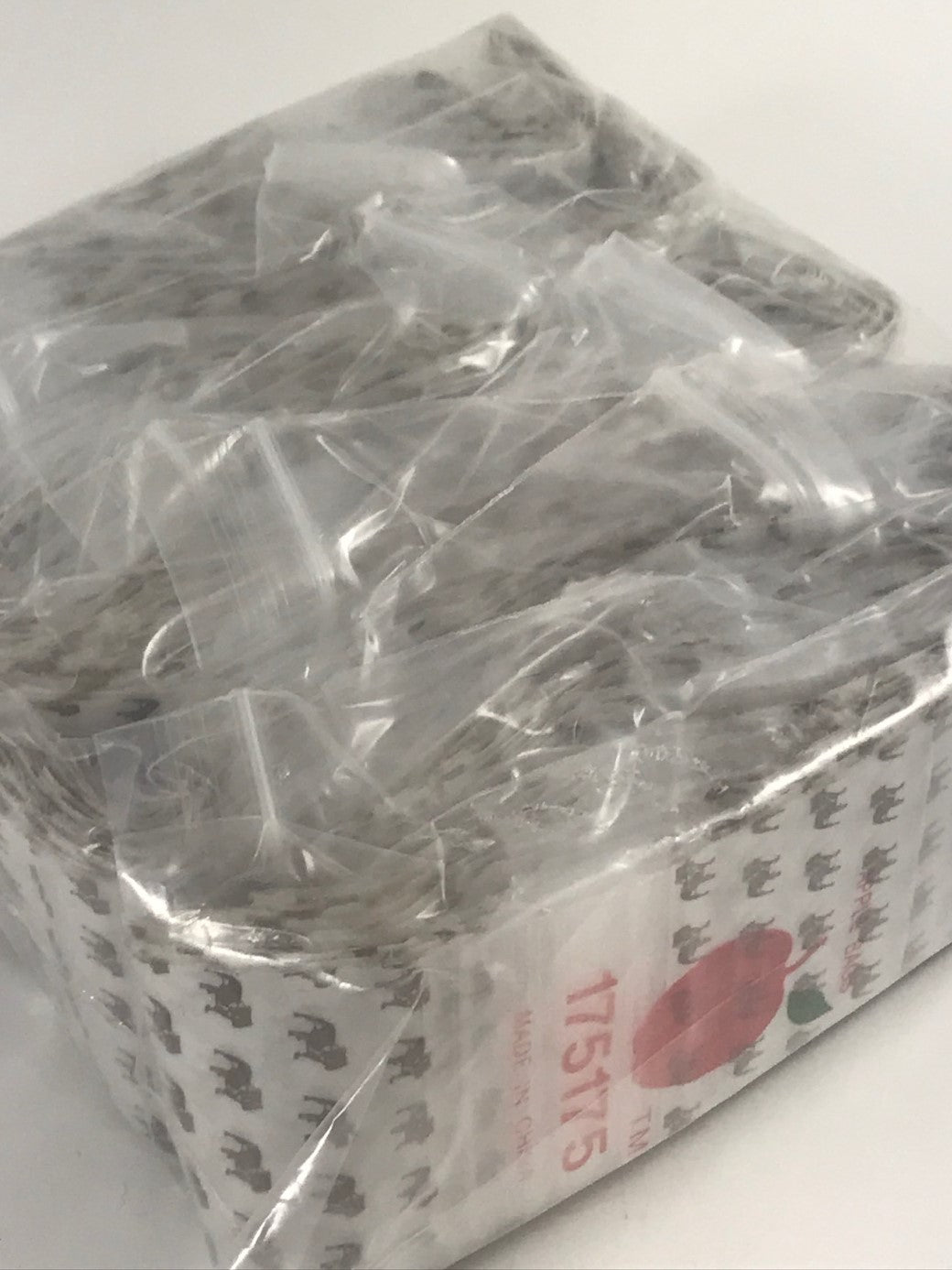 Original Apple Bags resealable bags, 1.75 x 1.75 inches, top dog design, perfect for packaging small items.
