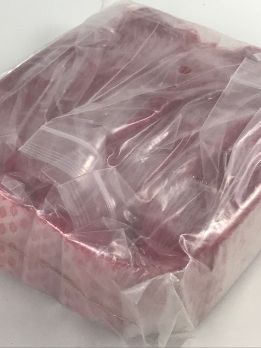 Original Apple Bags resealable storage bags, 1.75" x 1.75", with Lips design, ideal for organizing small items.