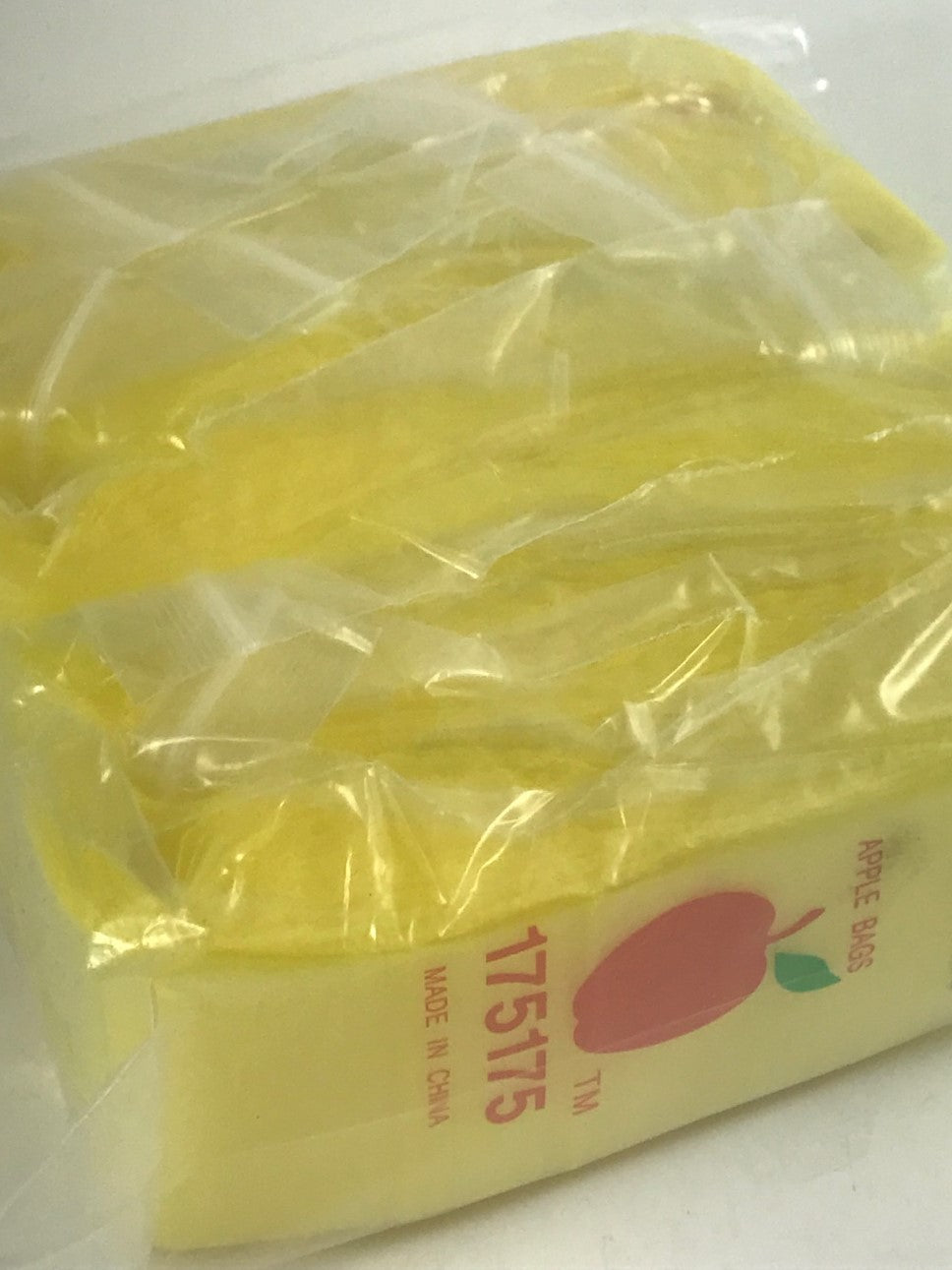 Yellow resealable bags from Original Apple Bags, 1.75 x 1.75 inches, ideal for storing small items or snacks.