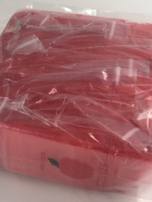 Red 1.75"x1.75" Original Apple Bags resealable bags, perfect for packaging small items or snacks.