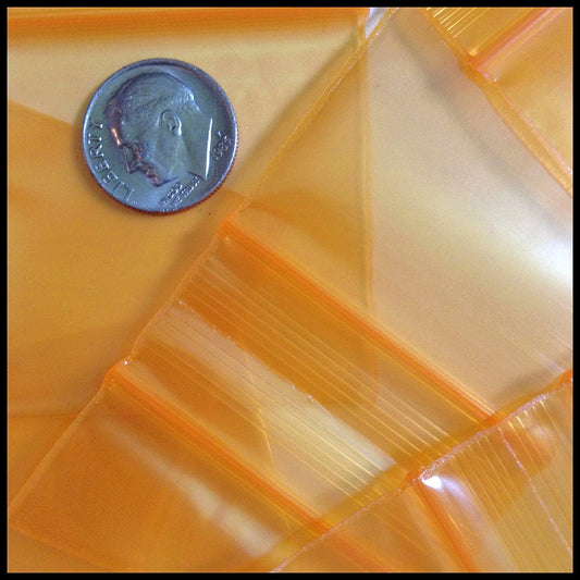 Orange Original Apple Bags measuring 5/8 inch by 5/8 inch, made from durable material, suitable for packaging small items.