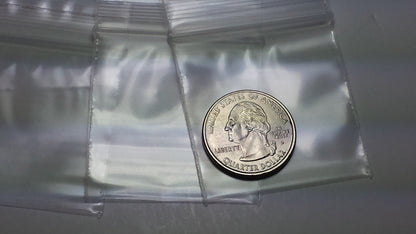 Clear white 5858 Original Apple Bags measuring 5/8 inch by 5/8 inch, shown flat on a white background.