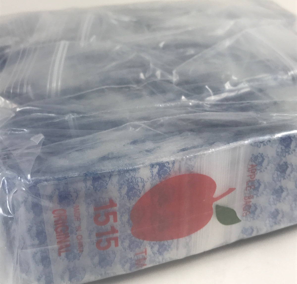 Resealable Original Apple Bags in smoke color, 1.5 x 1.5 inches, designed for storing small items or snacks.