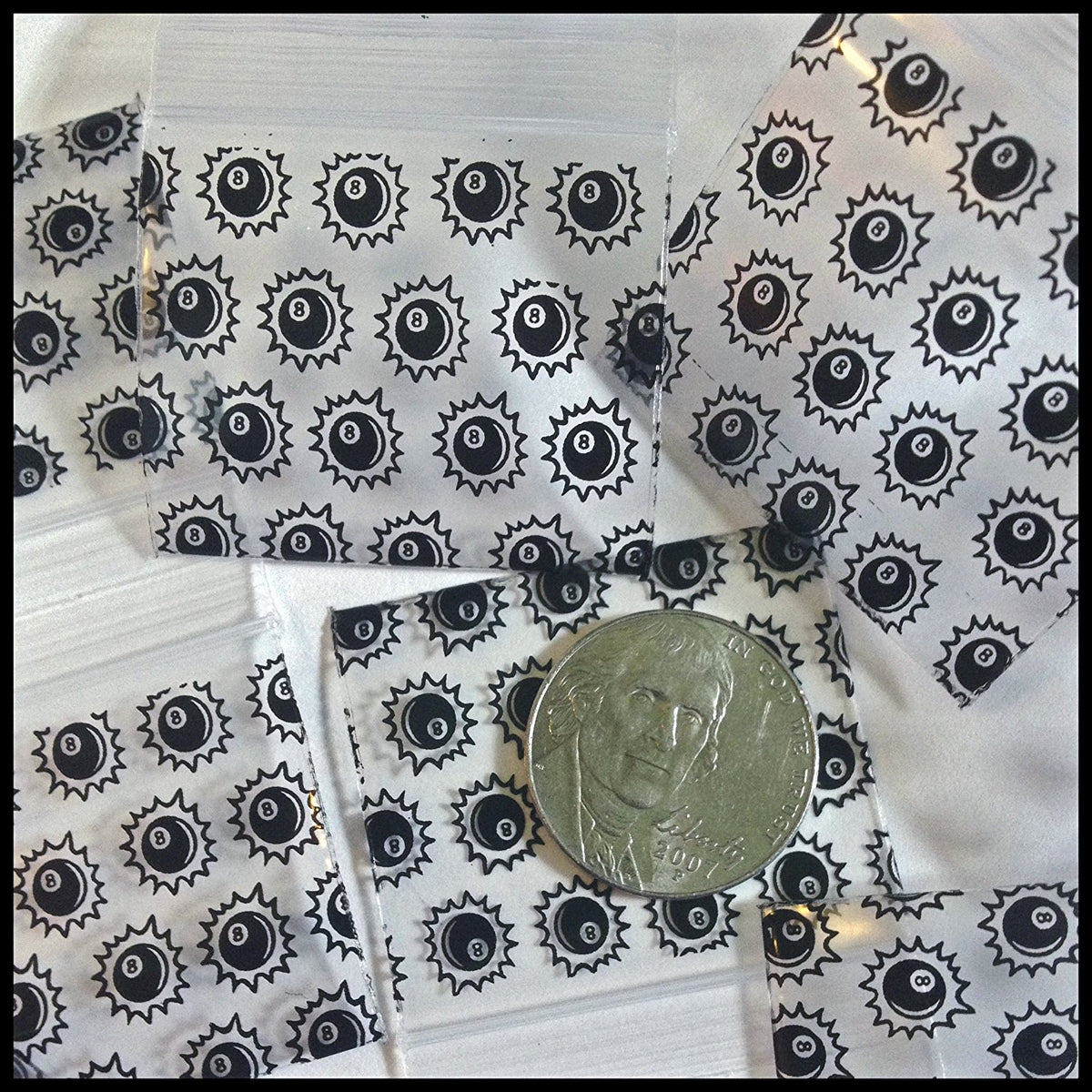 Set of eight resealable Original Apple Bags with 1.5-inch diameter, featuring an 8 ball design for packaging or storage.