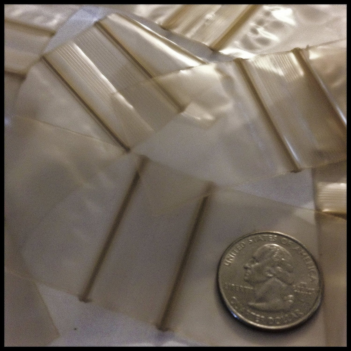 Gold 1515 Original Apple Bags resealable bags, 1.5 x 1.5 inches, made by Original Apple Bags for secure storage.