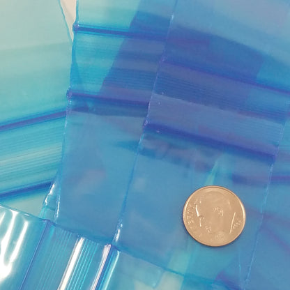 Blue 1.5"x1.5" resealable bags from Original Apple Bags, small plastic storage bags with secure closure.