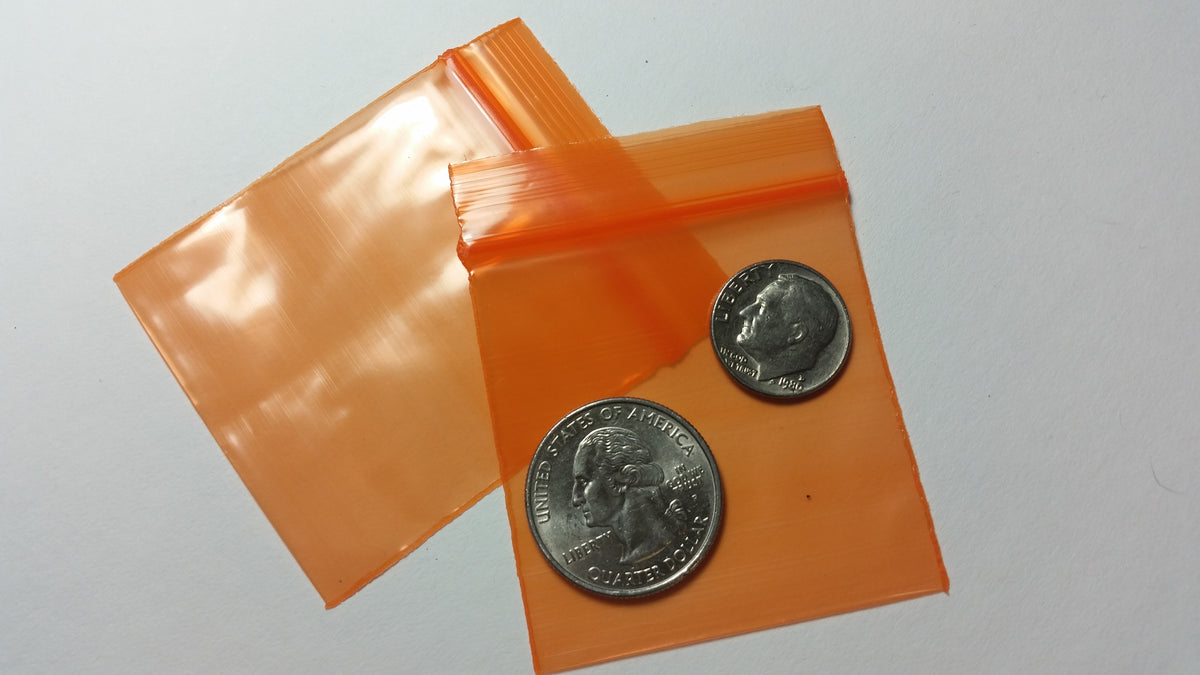 Orange Original Apple Bags measuring 5/8 inch by 5/8 inch, made from durable material, suitable for packaging small items.