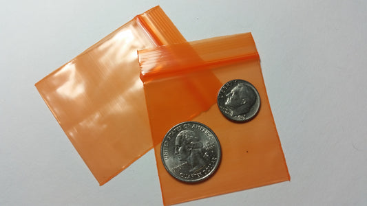Orange Original Apple Bags measuring 5/8 inch by 5/8 inch, made from durable material, suitable for packaging small items.