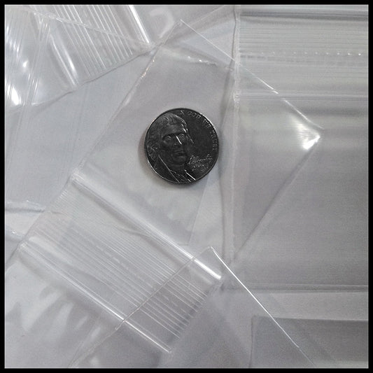 Clear white 5858 Original Apple Bags measuring 5/8 inch by 5/8 inch, shown flat on a white background.