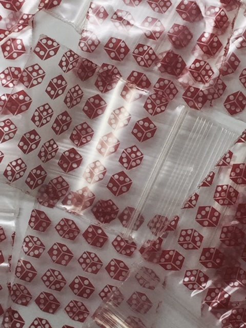 Resealable red dice-themed Apple Bags, 1.5" x 1.75", with original branding, suitable for packaging small items.