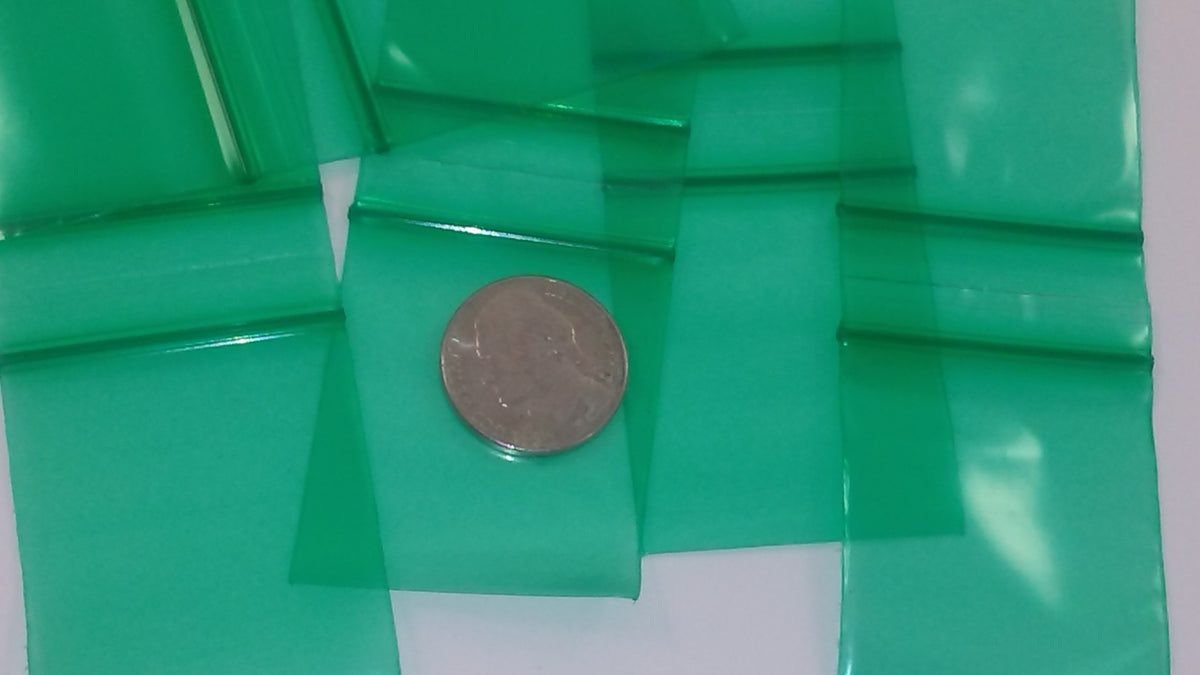 Green resealable Apple Bags by Original Apple Bags, measuring 1.5 x 1.75 inches, shown in a close-up image.