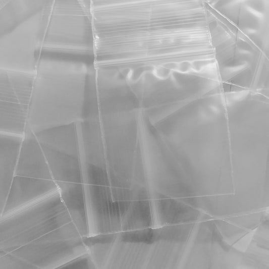 Clear resealable bags from Original Apple Bags, 1.5 x 1.75 inches, perfect for storing small items or packaging.