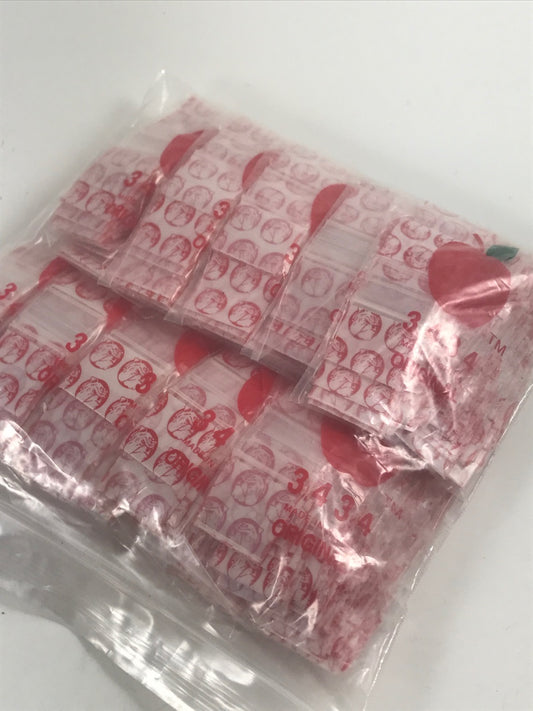 Resealable Apple Bags by Original Apple Bags, 3/4" x 3/4" in red dog design, suitable for snack or small item storage.