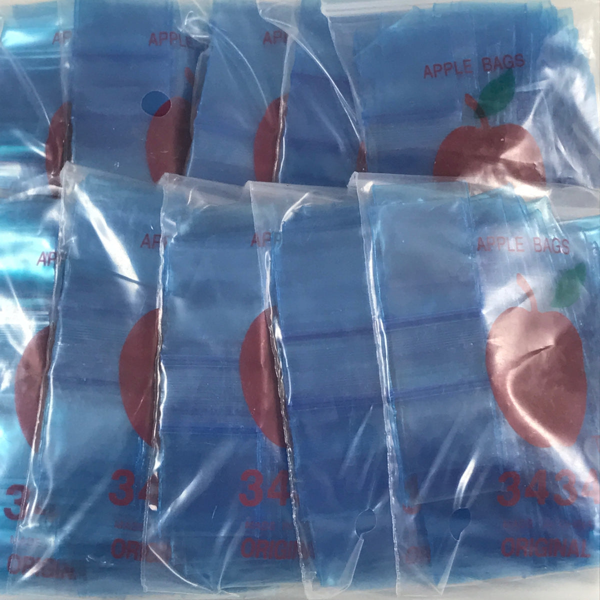Blue 3/4" x 3/4" resealable bags from Original Apple Bags, perfect for storing small items or organizing supplies.