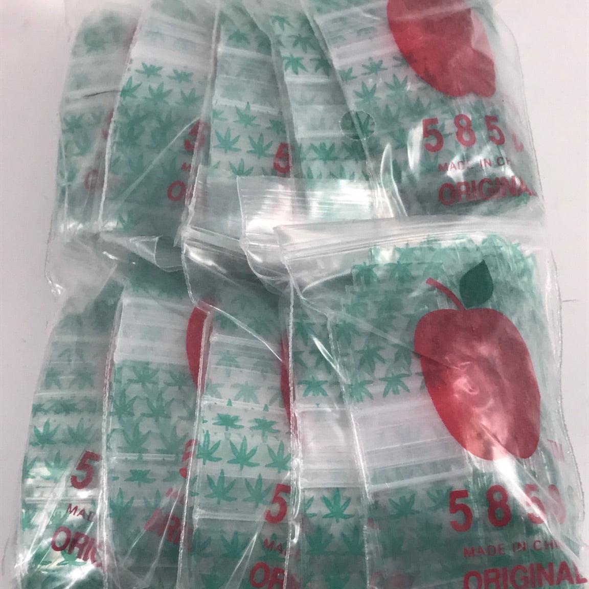 Original Apple Bags resealable bags with leaf design, 5/8 inch by 5/8 inch size, ideal for packaging and storage.