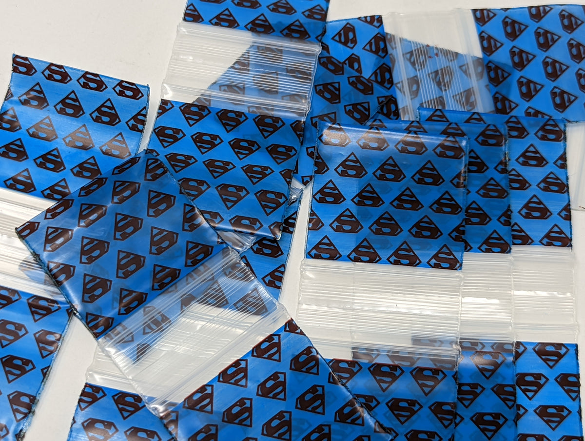Resealable bags featuring Superman design by Original Apple Bags, available in various sizes, perfect for storage and organization.