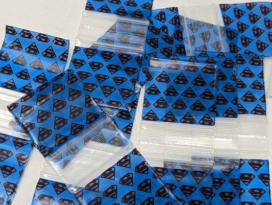 Resealable bags featuring Superman design by Original Apple Bags, available in various sizes, perfect for storage and organization.