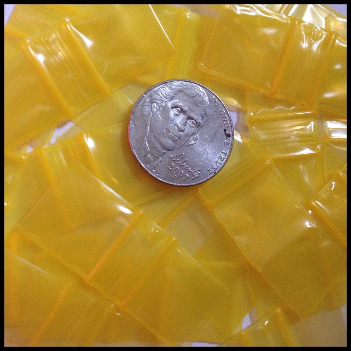Yellow 5858 Original Apple Bags resealable bags, 5/8 inch by 5/8 inch, made by Original Apple Bags for storage and packaging.