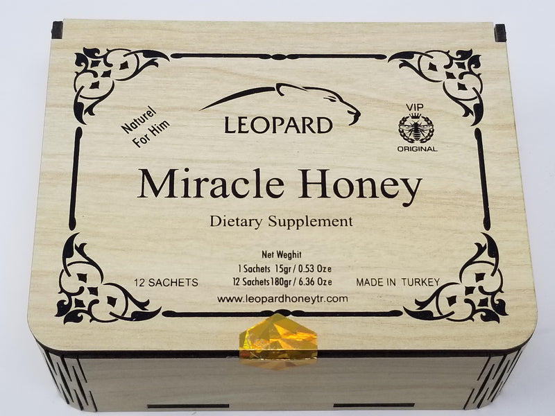 Leopard Miracle Honey dietary supplement bottle with golden honey and leopard logo, close-up of product label.